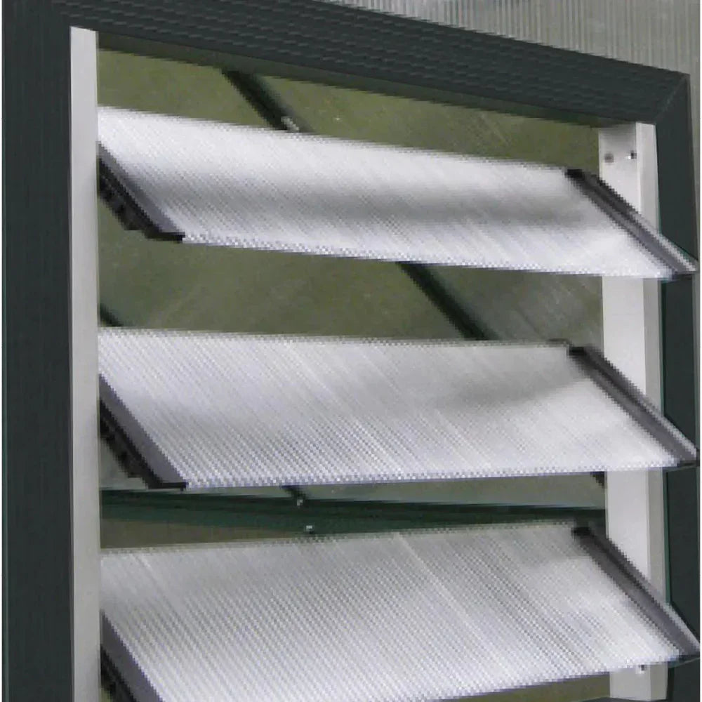 Industrial metal louver with angled perforated panels in gray and white frame